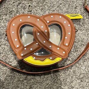 Amazon Brown Pretzel Crossbody Bag with Yellow Accents
